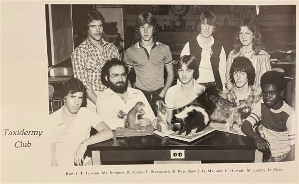 Students sit at a table with taxidermy samples